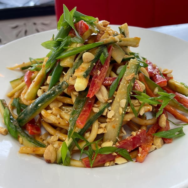 FlyBird's cold peanut noodles with cucumber, red peppers, scallions, and crushed peanuts.
