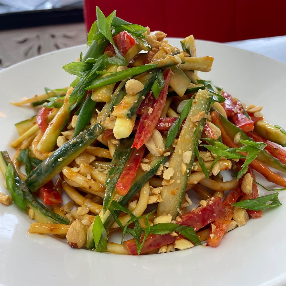 FlyBird's cold peanut noodles with cucumber, red peppers, scallions, and crushed peanuts.